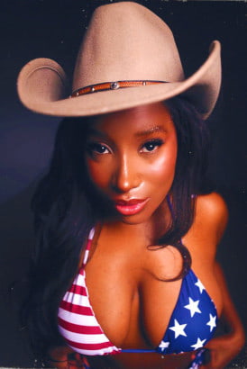 Black girl in a stars and striped bikini and cowboy hat